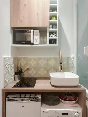 Cuisine ou kitchenette dans l'établissement Charming Studio in the center of Paris