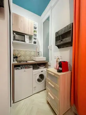 Cuisine ou kitchenette dans l'établissement Charming Studio in the center of Paris