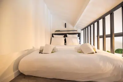 Un ou plusieurs lits dans un hébergement de l'établissement Lovely Nest in Paris