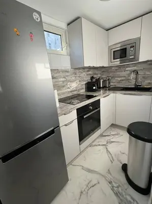 Cuisine ou kitchenette dans l'établissement Duplex près des Champs-Élysées
