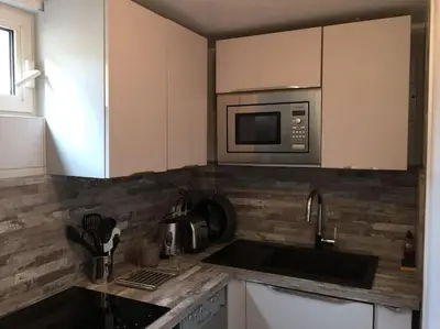 Cuisine ou kitchenette dans l'établissement Duplex près des Champs-Élysées