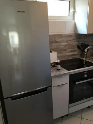 Cuisine ou kitchenette dans l'établissement Duplex près des Champs-Élysées