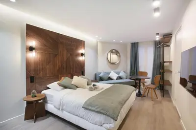 Un ou plusieurs lits dans un hébergement de l'établissement Studio Sacré coeur by Studio prestige