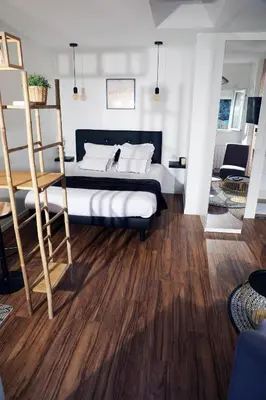 Un ou plusieurs lits dans un hébergement de l'établissement Eiffel Tour Cosy chesterfield