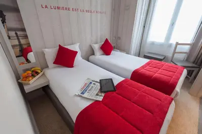 Un ou plusieurs lits dans un hébergement de l'établissement Hôtel le 209 Paris Bercy