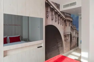 Un ou plusieurs lits dans un hébergement de l'établissement Hôtel le 209 Paris Bercy