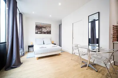Un ou plusieurs lits dans un hébergement de l'établissement Loft style apartment