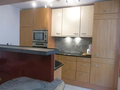 Cuisine ou kitchenette dans l'établissement Appartement Faubourg Montmartre CityCosy
