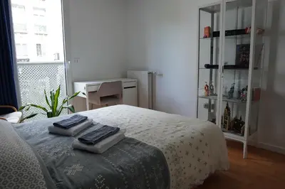 Un ou plusieurs lits dans un hébergement de l'établissement Charmant Appartement au Pré