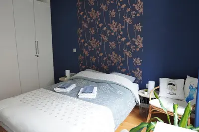 Un ou plusieurs lits dans un hébergement de l'établissement Charmant Appartement au Pré