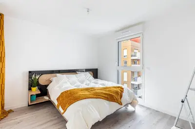 Un ou plusieurs lits dans un hébergement de l'établissement GuestReady - Bel Apt. à Asnières-sur-Seine
