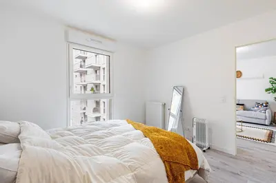Un ou plusieurs lits dans un hébergement de l'établissement GuestReady - Bel Apt. à Asnières-sur-Seine