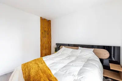 Un ou plusieurs lits dans un hébergement de l'établissement GuestReady - Bel Apt. à Asnières-sur-Seine