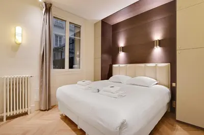 Un ou plusieurs lits dans un hébergement de l'établissement Luxurious apartment - 2BR-6P - Saint-Germain