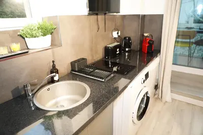 Cuisine ou kitchenette dans l'établissement Eiffel Tour - Cosy Daisy