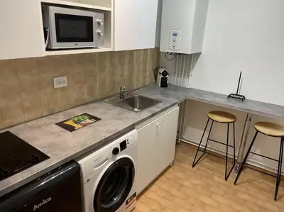 Cuisine ou kitchenette dans l'établissement Eiffel Tour Cosy blue