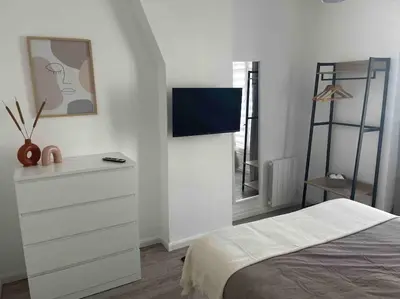 Un ou plusieurs lits dans un hébergement de l'établissement Eiffel Tour cosy farniente