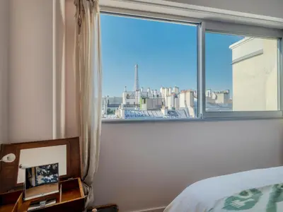 Un ou plusieurs lits dans un hébergement de l'établissement Eiffel Tower Design residence