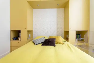 Un ou plusieurs lits dans un hébergement de l'établissement Chic flat Place des Vosges
