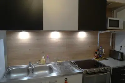 Cuisine ou kitchenette dans l'établissement Appartement calme et lumineux à 5 mn de Paris