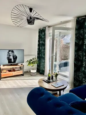 Coin salon dans l'établissement Appartement avec Jardin - La Plaine Saint Denis