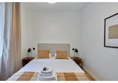 Un ou plusieurs lits dans un hébergement de l'établissement Apartment in the center of Paris by Studio prestige