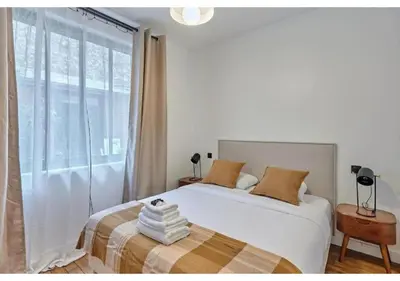 Un ou plusieurs lits dans un hébergement de l'établissement Apartment in the center of Paris by Studio prestige