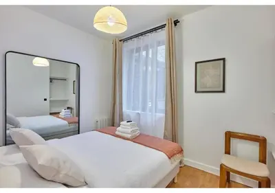 Un ou plusieurs lits dans un hébergement de l'établissement Apartment in the center of Paris by Studio prestige