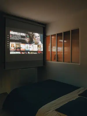 Un ou plusieurs lits dans un hébergement de l'établissement Alcova - Stade de France - Jacuzzi - Cinema