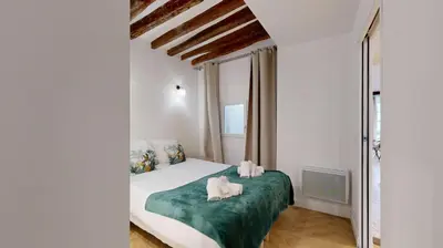 Un ou plusieurs lits dans un hébergement de l'établissement 200 Suite DDJ - Superbe Appartement à Paris