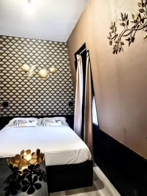 Un ou plusieurs lits dans un hébergement de l'établissement Chic & Cosy Eiffel Tower - Champs Elysées