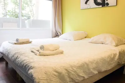 Un ou plusieurs lits dans un hébergement de l'établissement Colored Appt To Beaugrenelle