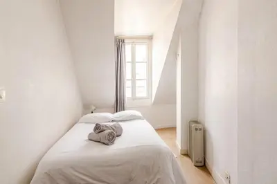 Un ou plusieurs lits dans un hébergement de l'établissement Appartement 4 personnes au centre Paris - Chatelet