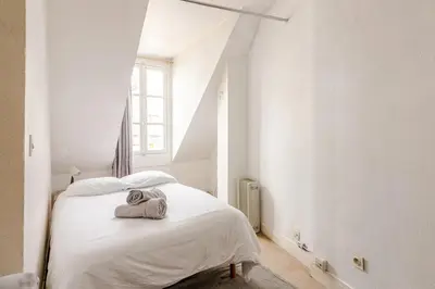 Un ou plusieurs lits dans un hébergement de l'établissement Appartement 4 personnes au centre Paris - Chatelet