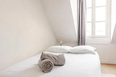 Un ou plusieurs lits dans un hébergement de l'établissement Appartement 4 personnes au centre Paris - Chatelet