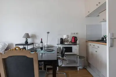 Cuisine ou kitchenette dans l'établissement Le Cozy Appartement + balcon ensoleillé + Parking