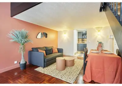 Coin salon dans l'établissement Apartment Le Marais Place des Vosges by Studio Prestige