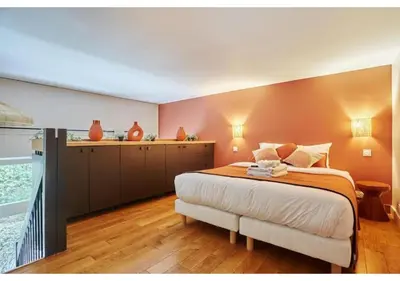 Un ou plusieurs lits dans un hébergement de l'établissement Apartment Le Marais Place des Vosges by Studio Prestige