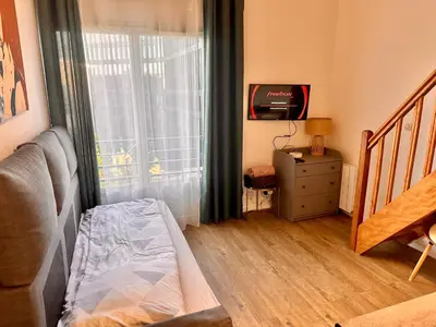 Un ou plusieurs lits dans un hébergement de l'établissement 2 pièces duplex Issy Les Moulineaux Ascenseur internet