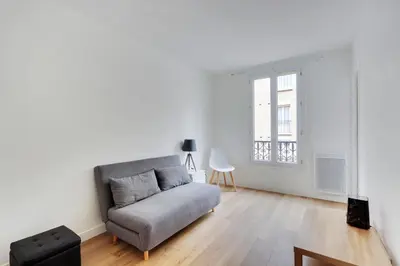 Un ou plusieurs lits dans un hébergement de l'établissement studio cosy jules Joffrin