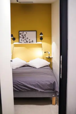Un ou plusieurs lits dans un hébergement de l'établissement Charming apartment near Notre-Dame