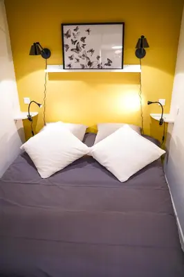 Un ou plusieurs lits dans un hébergement de l'établissement Charming apartment near Notre-Dame