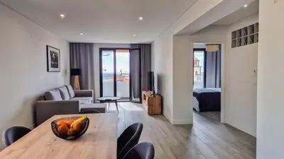 Coin salon dans l'établissement GuestReady - Appartement Chic avec Balcon