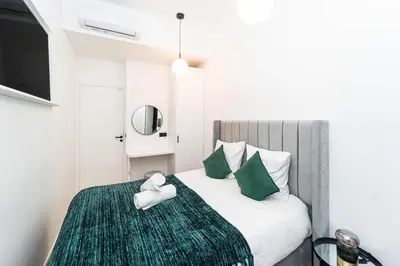 Un ou plusieurs lits dans un hébergement de l'établissement Pick A Flat's Apartment in Notre-Dame de Paris - Rue Saint-Séverin