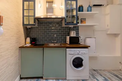 Cuisine ou kitchenette dans l'établissement Joli 3 pièces proche Marais