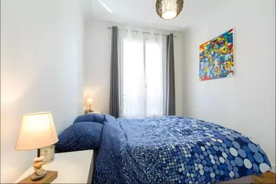 Un ou plusieurs lits dans un hébergement de l'établissement Appartement 2 pièces avec vue Tour Eiffel