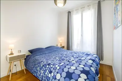 Un ou plusieurs lits dans un hébergement de l'établissement Appartement 2 pièces avec vue Tour Eiffel
