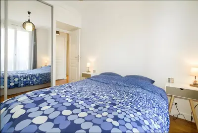 Un ou plusieurs lits dans un hébergement de l'établissement Appartement 2 pièces avec vue Tour Eiffel