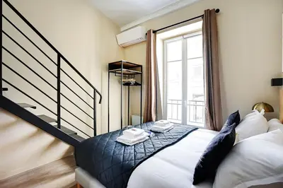 Un ou plusieurs lits dans un hébergement de l'établissement Apartment with terrace - Parc monceau
