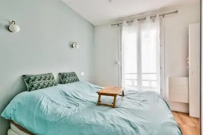Un ou plusieurs lits dans un hébergement de l'établissement Paris9